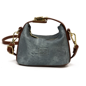 Mini grey denim crossbody bag for kids featuring brown leather handles and golden hardware
