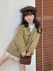 Detail of a stylish leopard print mini bag for girls paired with an autumn kid's outfit