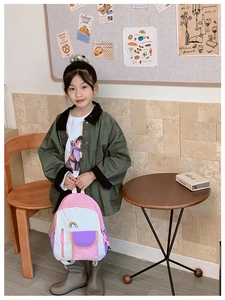 Detail of colorful rainbow embroidered schoolbag for kids with comfortable padded straps