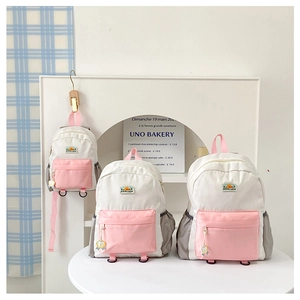 Detailed set of three Korean-style backpacks featuring contrast colors and mountain embroidery