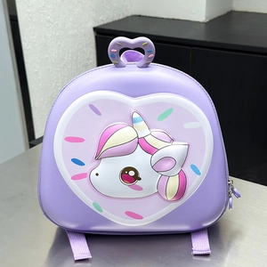 Detail of 3D unicorn and heart donut patterns on purple EVA hard shell kids backpack