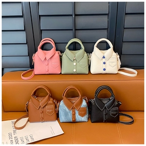 Mini shirt-style toddler crossbody bags in six colors displayed on a leather bench