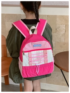 Detailed close-up of pink and beige kids' backpack showing the drawstrings and brand logo