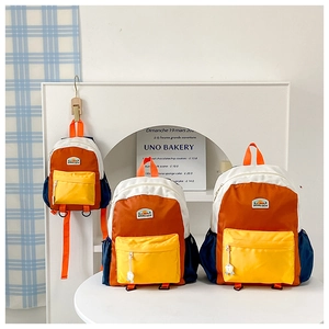 Three sizes of color-block kids backpacks in blue, orange and white showing storage details