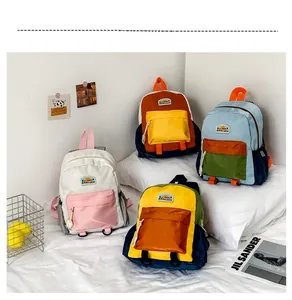 Detailed showcase of stylish color-block backpacks for kids in various vibrant shades