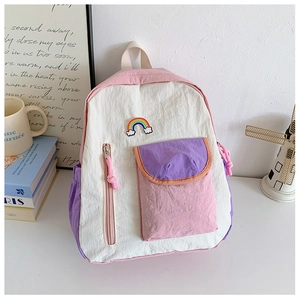 Detail of macaron color block nylon kids backpack with rainbow cloud embroidery