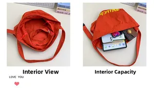 Détail du sac bandoulière en toile rouge avec poche intérieure zippée et grande capacité