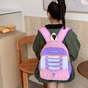 Kids colorful patchwork backpack with drawstring detail and sporty pink-purple design
