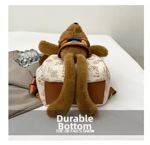 Detail of plush bear backpack featuring a durable wear-resistant bottom for daily use
