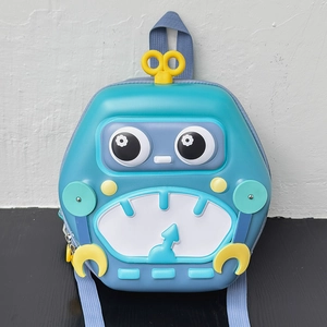 Detail view of the blue robot hardshell backpack featuring yellow clockwork and gear design