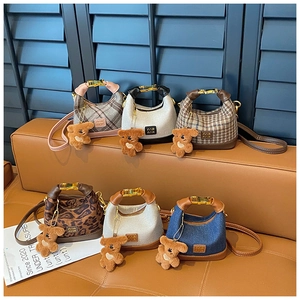 Detailed collection of mini girls' handbags with leopard print, plaid, and bear charms