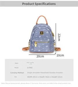 Detailed view of blue bear print backpack with dimensions 20x10x22cm and brown leather straps
