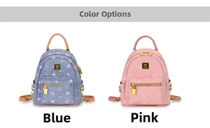 Detail of blue and pink mini backpacks with bear patterns and golden bear zippers