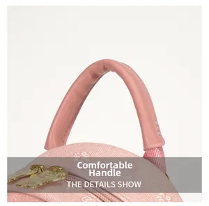 Detail of pink backpack showing soft padded handle and cartoon gold metal zipper charm