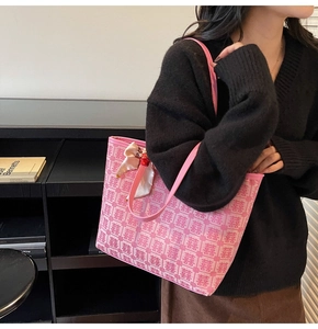 Close-up of pink festive tote bag featuring Double Happiness jacquard and bow detail