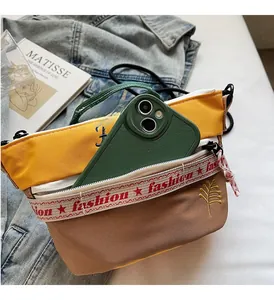 Detail view of canvas crossbody bag interior with zipper pocket showing phone storage