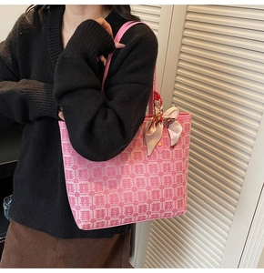 Detailed pink tote with red double happiness jacquard and silk ribbon knot on handle