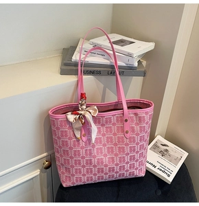 Detailed view of pink jacquard wedding tote bag with silk scarf and Xi pattern