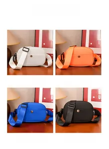 Detail view of water-resistant nylon kids chest bags in four assorted colors with straps