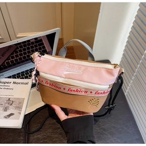 Detail of pink canvas crossbody bag with Fashion embroidery and multi-zipper pockets