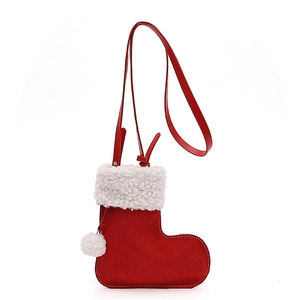 Cute red Christmas stocking crossbody bag with white fleece trim and pom-pom accessory