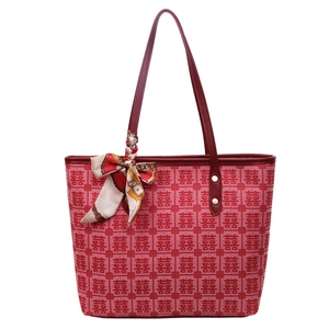 Red festive tote bag with traditional pattern and decorative silk scarf for wedding
