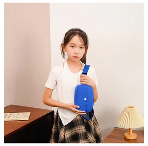 Blue nylon mini chest bag for kids with adjustable strap and silver snap closure