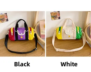Two colorful contrast shoulder bags for kids featuring cute yellow duck embroidery detail