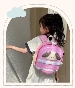 Detail view of a pink EVA hardshell toddler backpack with a cute cartoon puppy design