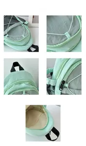 Detail view of mint green nylon kids backpack showing zippers and embroidery