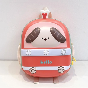 Macro detail of cartoon dog backpack with eggshell design and bone handle detail