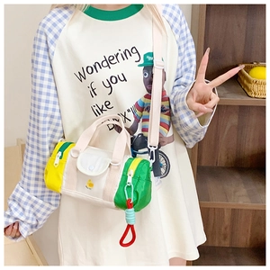 Close-up of kids colorful barrel bag with chicken embroidery and adjustable strap