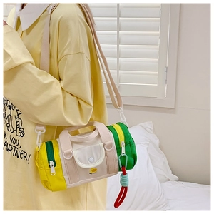 Detailed view of kids crossbody bag featuring colorful patchwork and cute duck embroidery