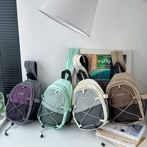 Detailed set of four multi-functional outdoor nylon sling bags in various contrast colors