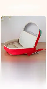 Detail view of the red toddler backpack showing its internal large capacity and mesh pockets