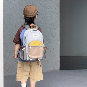 Kids color-block backpack in grey and yellow with large capacity for school and travel