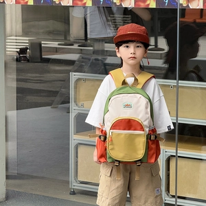 Contrast color school backpack for kids featuring adjustable straps and street style look