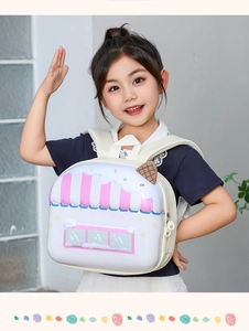 Detail of cute hard shell kids backpack shaped like a dessert shop with cream decor