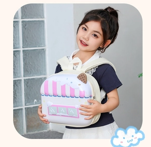 Close-up of kids hard shell backpack featuring 3D dessert shop design and waffle detail