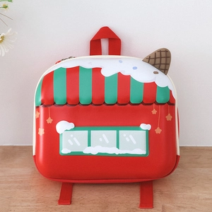 Detail of red shell-shaped toddler backpack with sweet dessert house 3D design elements