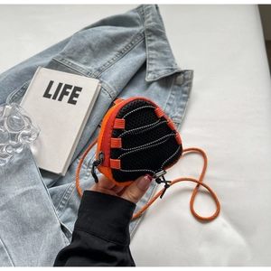 Detail of mini triangle kids bag with orange mesh and climbing rope shoulder strap