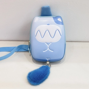 Detail of light blue cartoon cat crossbody bag with plush pom-pom and shell design