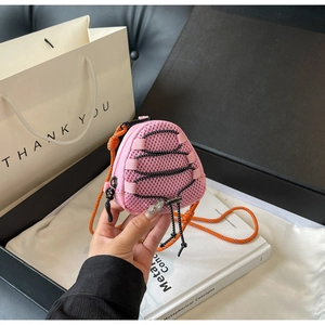 Detail of pink mesh mini crossbody bag with orange cord and stylish drawstring design