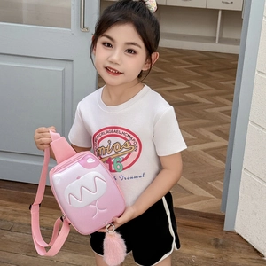 Pink kids crossbody chest bag with cute cartoon monster face and plush pompom tail