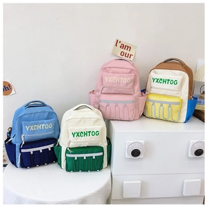 Detail view of four large-capacity backpacks with multi-pocket design and contrast colors