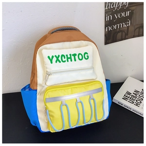 Detail view of the multi-pocket contrast color school bag with rope accents