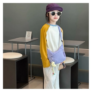 Purple canvas crossbody moon bag for kids with yellow crescent moon plush pendant