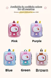 Detail of multi-color cartoon eggshell backpacks for kids featuring rabbit ears and EVA hard shell
