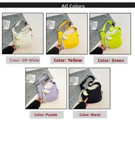 Detail view of colorful crescent crossbody bags with plush moon charms in five colors