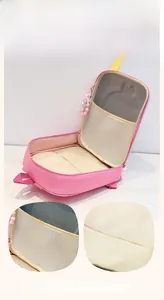 Detail of kids pink backpack showing spacious interior main compartment and mesh pocket
